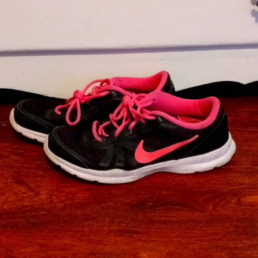 Black and pink Nike shoes